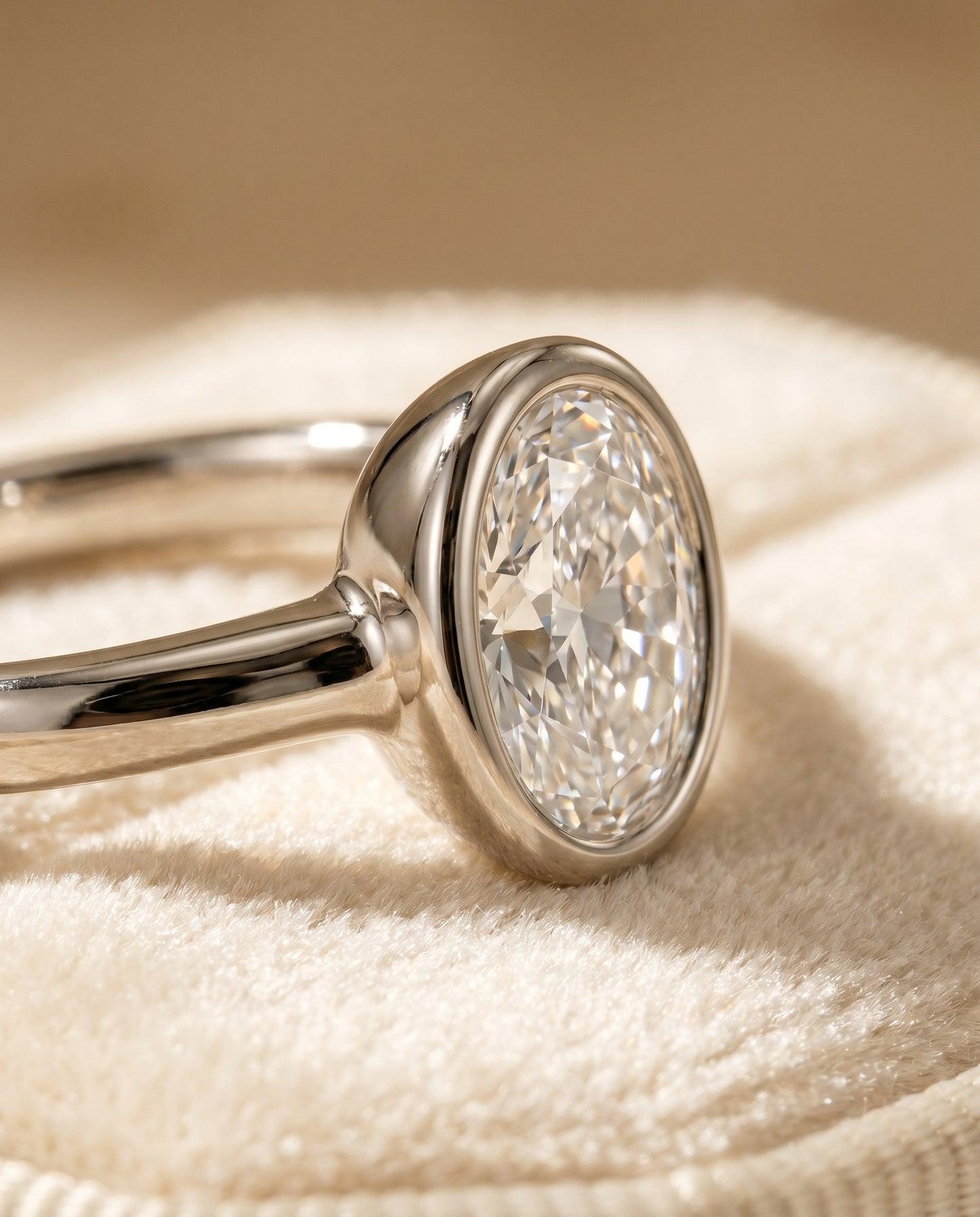 The Agnes Bezel Solitaire Engagement Ring Setting for Oval Diamonds in Platinum