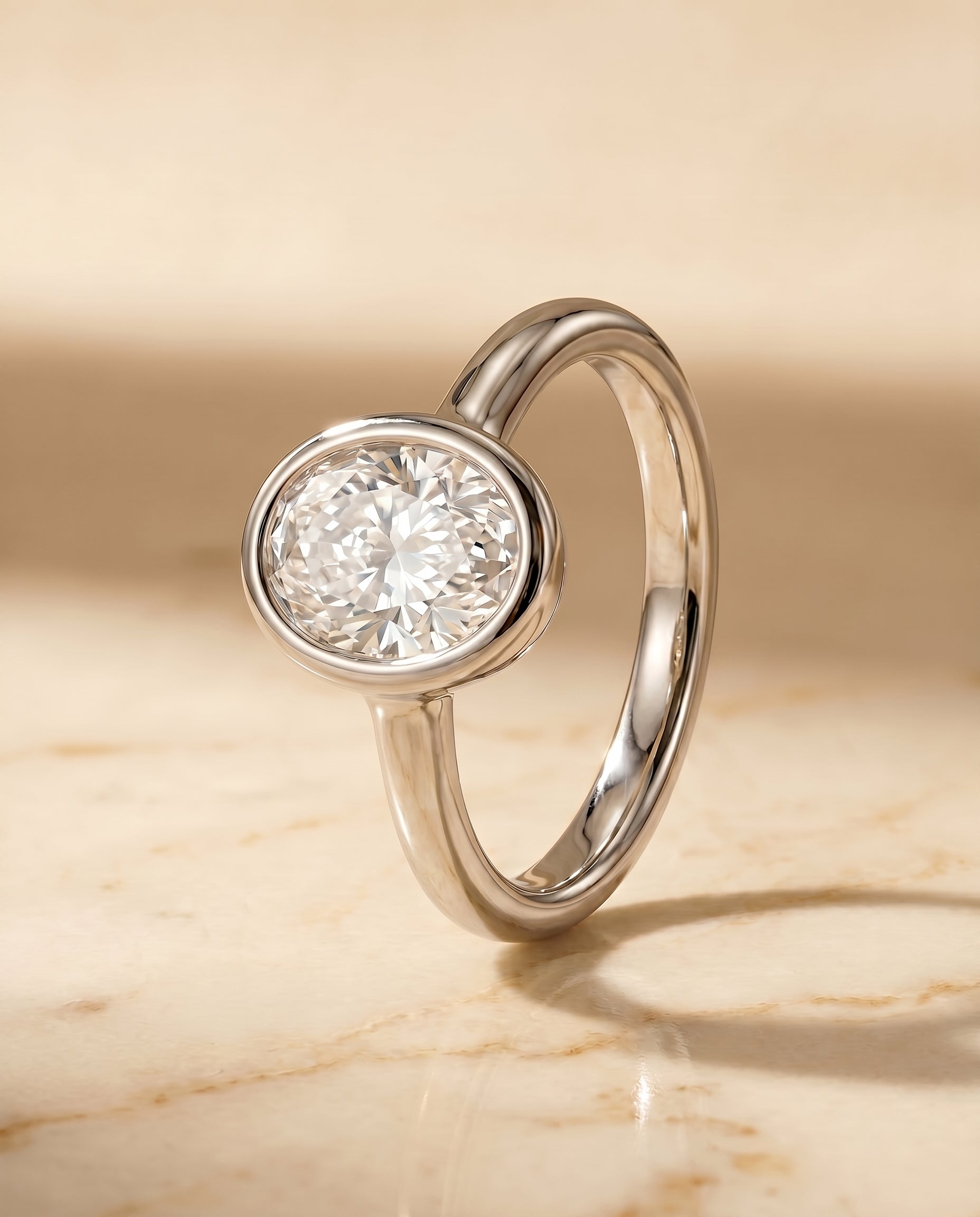 Bezel Solitaire In styling on The Agnes oval engagement ring setting | RockHer