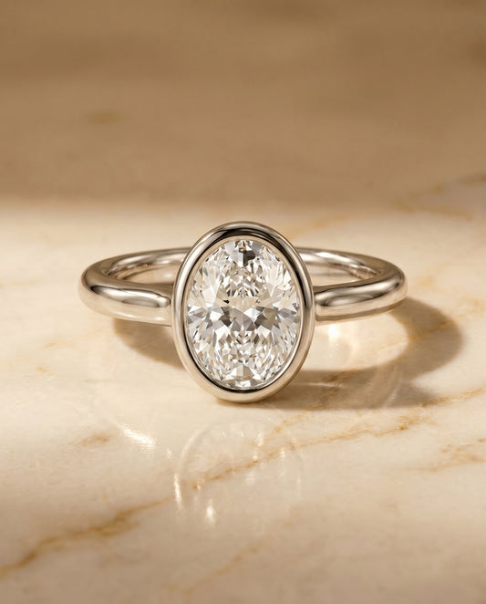 The Agnes Bezel Solitaire Engagement Ring Setting for Oval Diamonds in Platinum | RockHer