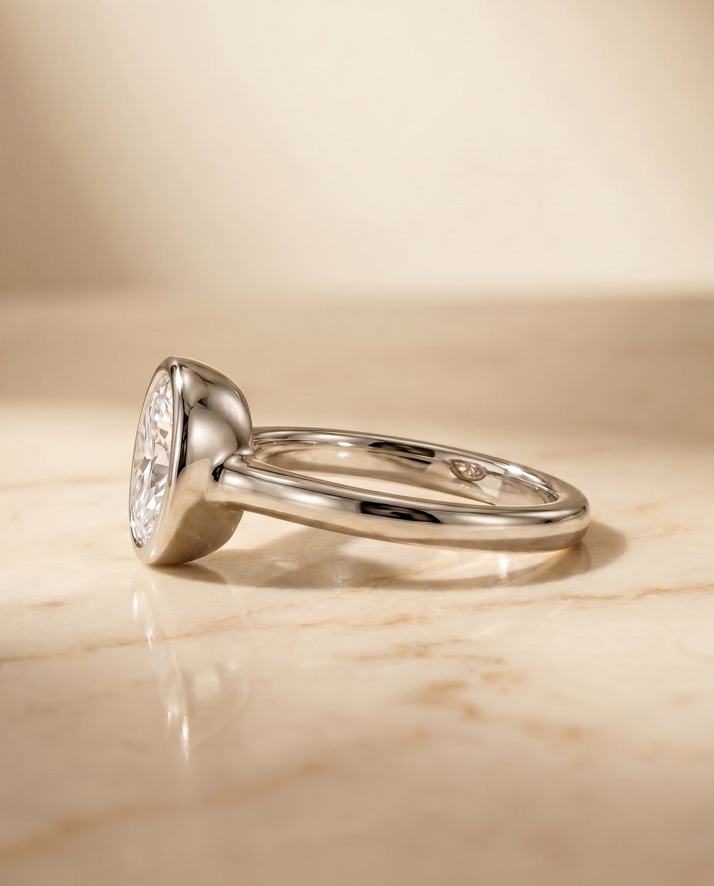 Agnes Select Bezel Solitaire In Oval Lab Diamond Engagement Ring in 18K White Gold, side view | RockHer