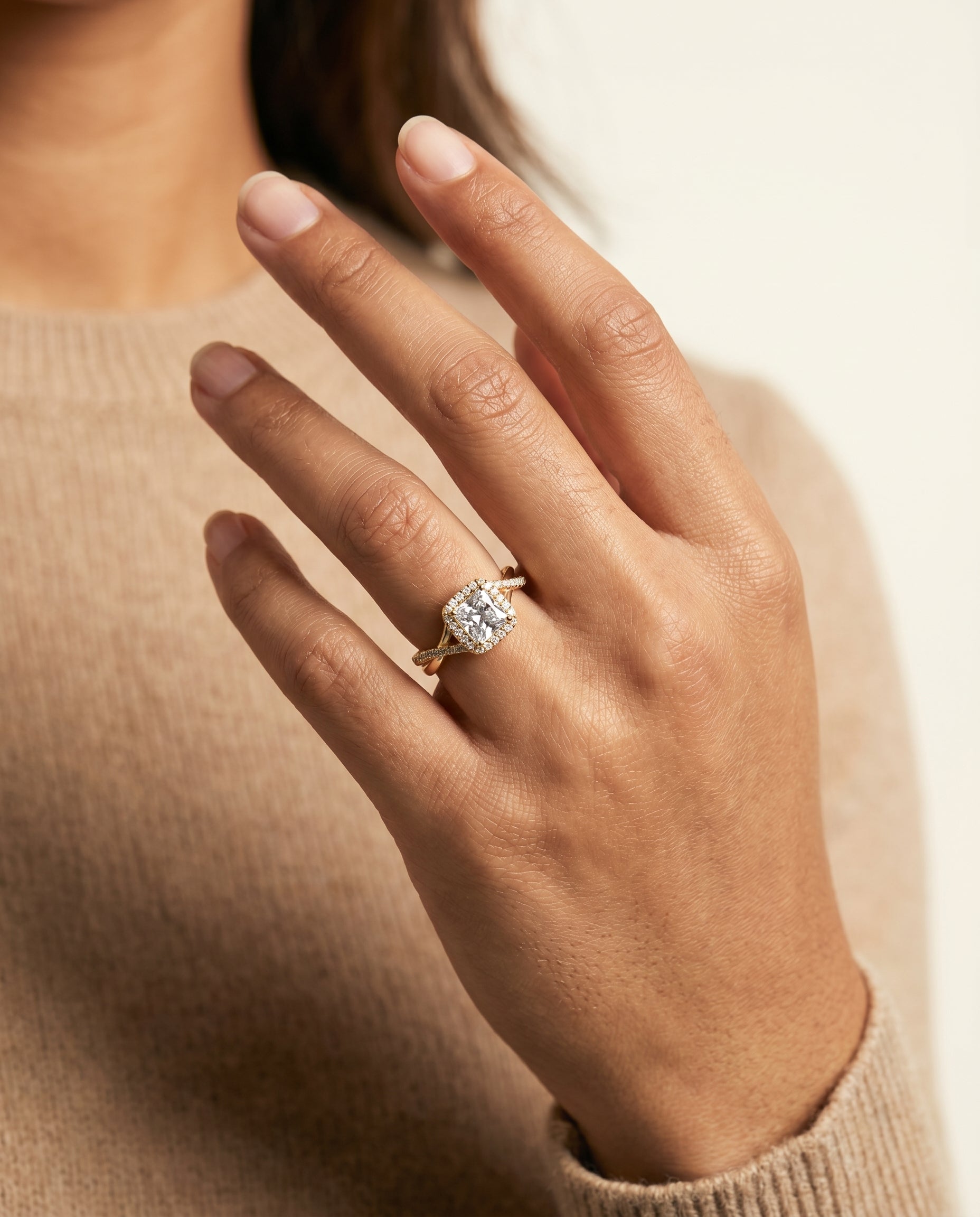 Bell Select Bold Twist Pavé Halo Princess Cut Lab Diamond Engagement Ring in 18K Yellow Gold, shown on hand | RockHer