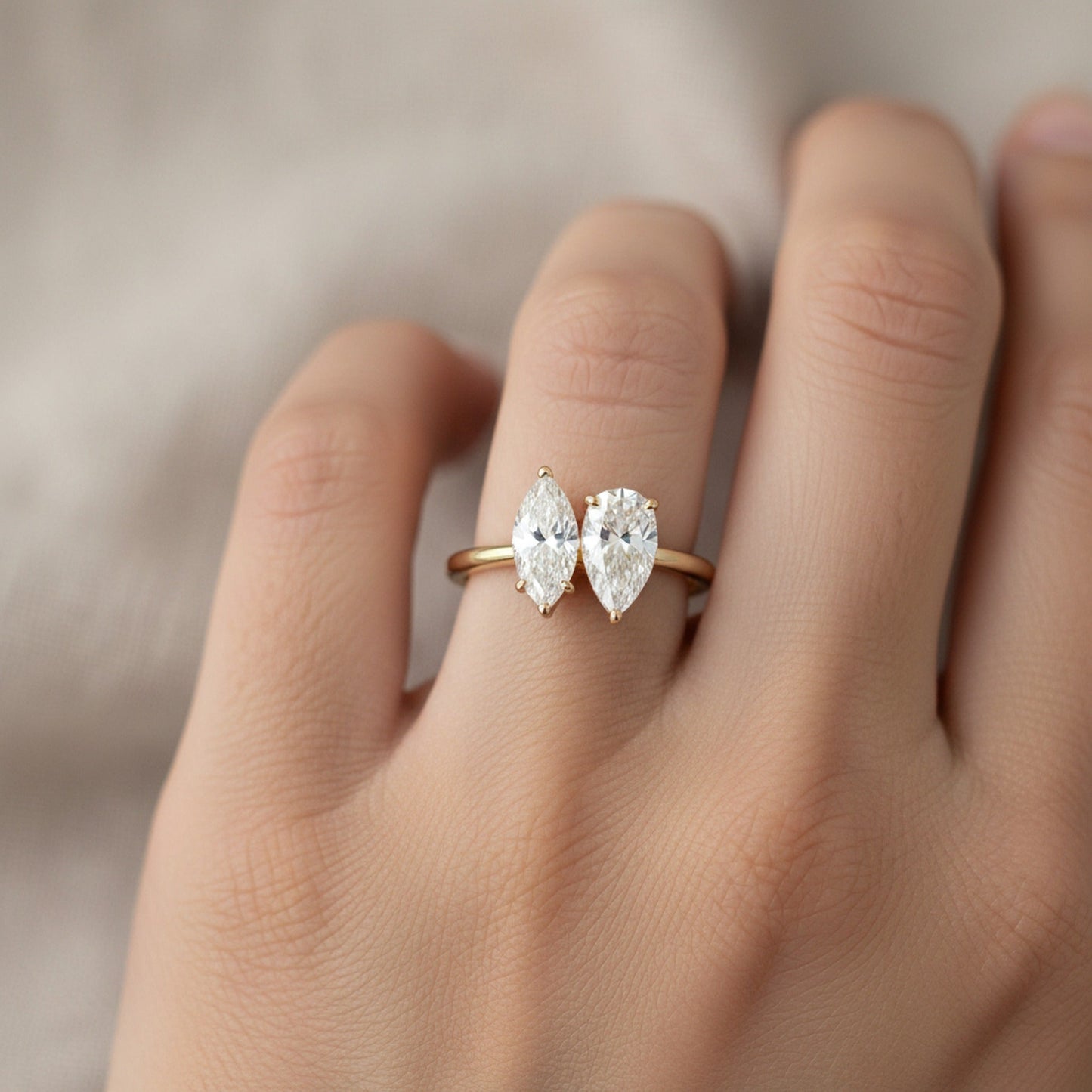 Brandy Toi et Moi Marquise & Pear engagement ring setting worn on hand