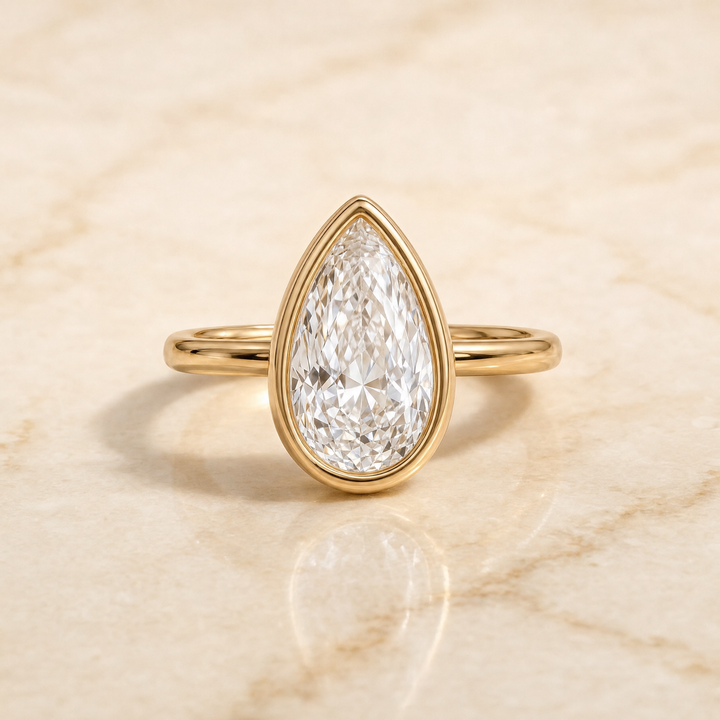 The Agnes Bezel Solitaire In Briolette Engagement Ring Setting in 18K Yellow Gold