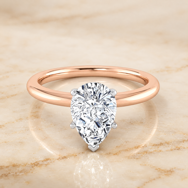 The Floria Comfort Fit Claw Prong Solitaire Pear Engagement Ring Setting in 14K Rose Gold