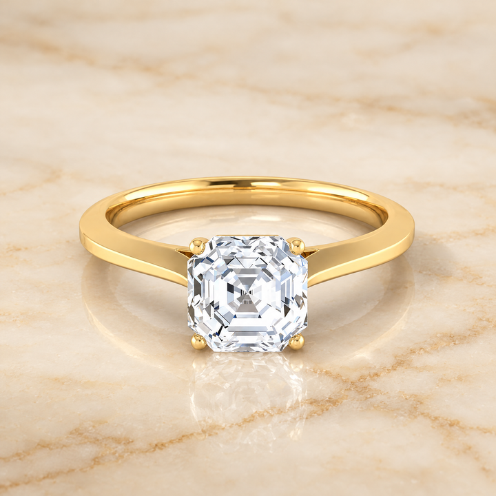The Elena Timeless Graduated Beveled Shank Solitaire Asscher Cut Engagement Ring Setting in 18K Yellow Gold
