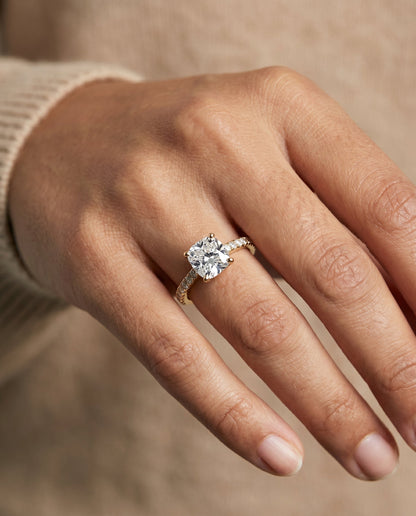 Donna Select Cathedral French Pavé Solitaire Cushion Cut Lab Diamond Engagement Ring in 14K Yellow Gold, shown on hand | RockHer