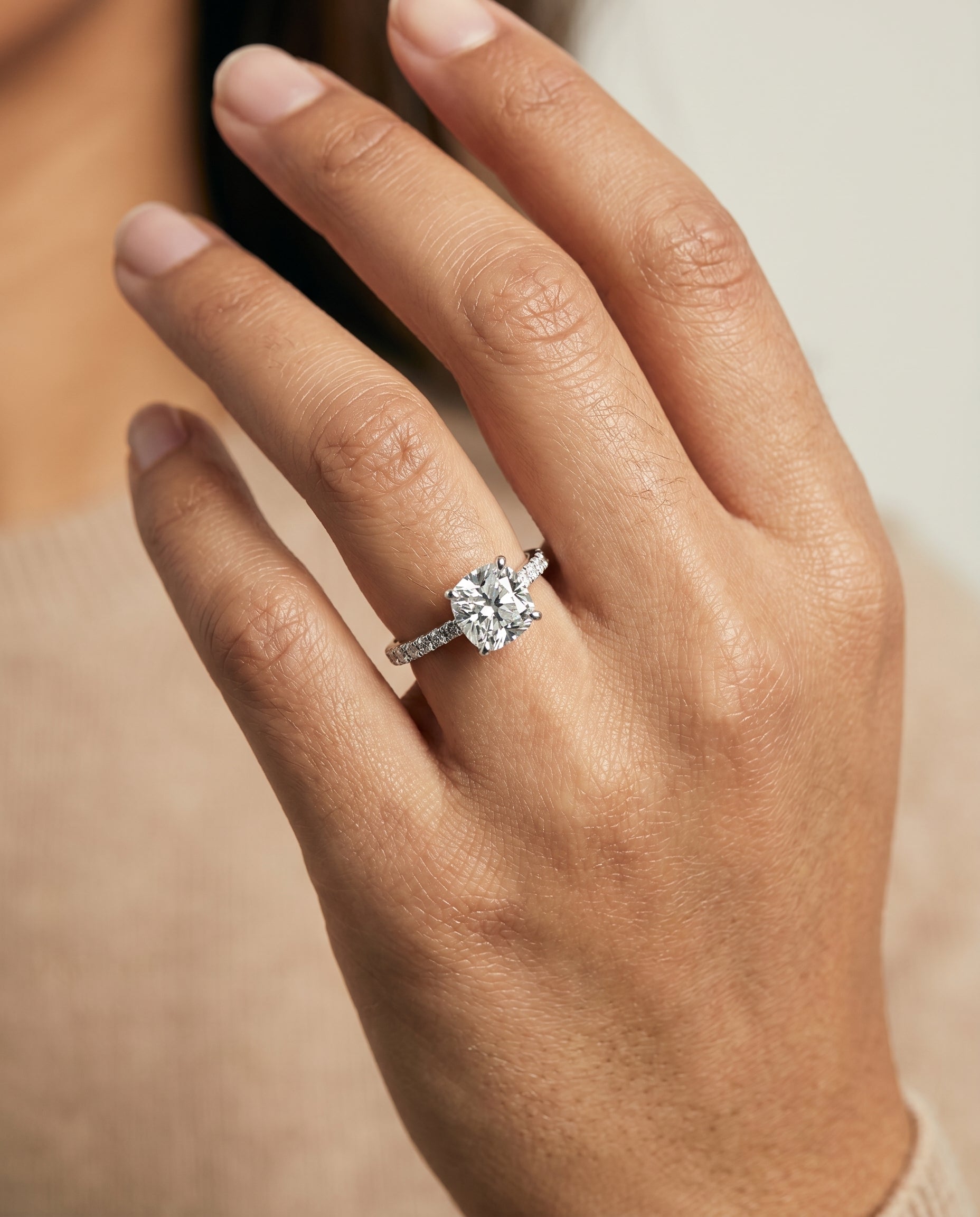 Donna Select Cathedral French Pavé Solitaire Cushion Cut Lab Diamond Engagement Ring in Platinum, shown on hand | RockHer