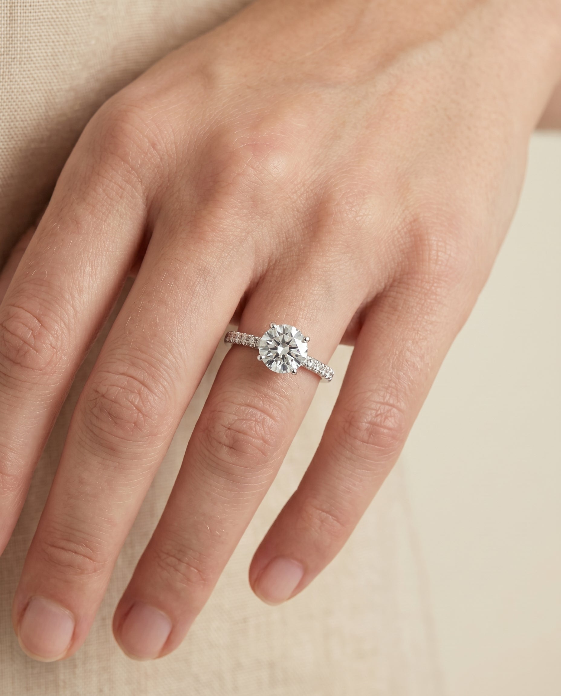 Donna Select Cathedral French Pavé Solitaire Round Lab Diamond Engagement Ring in Platinum, shown on hand | RockHer