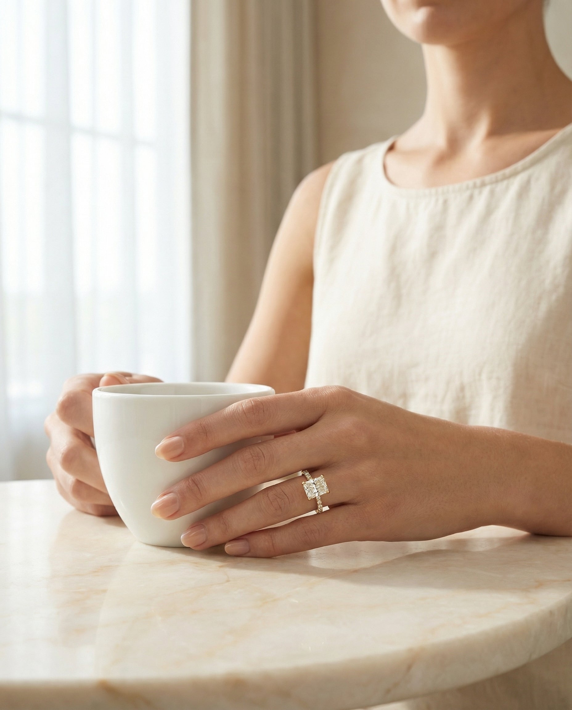 The Donna radiant setting in 18K Yellow Gold, a cathedral french pavé solitaire cut design from RockHer