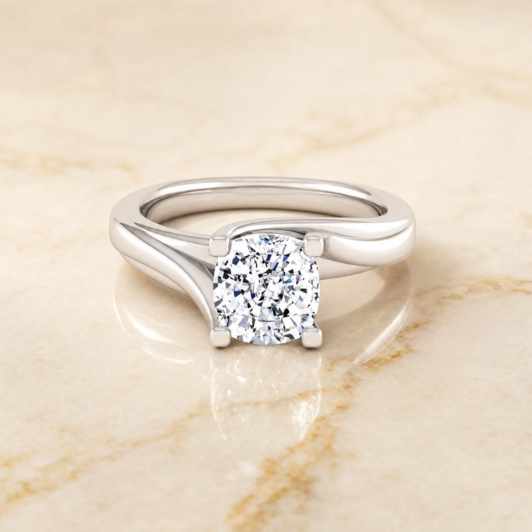 The Joplin Twisted Bypass Solitaire Cushion Cut Engagement Ring Setting in Platinum