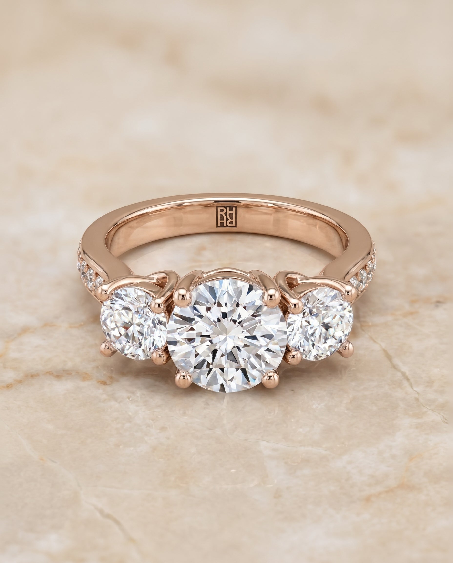Round Brilliant, Channel Pavé Three Stone, in 14K Rose Gold, pave setting – angled view | RockHer