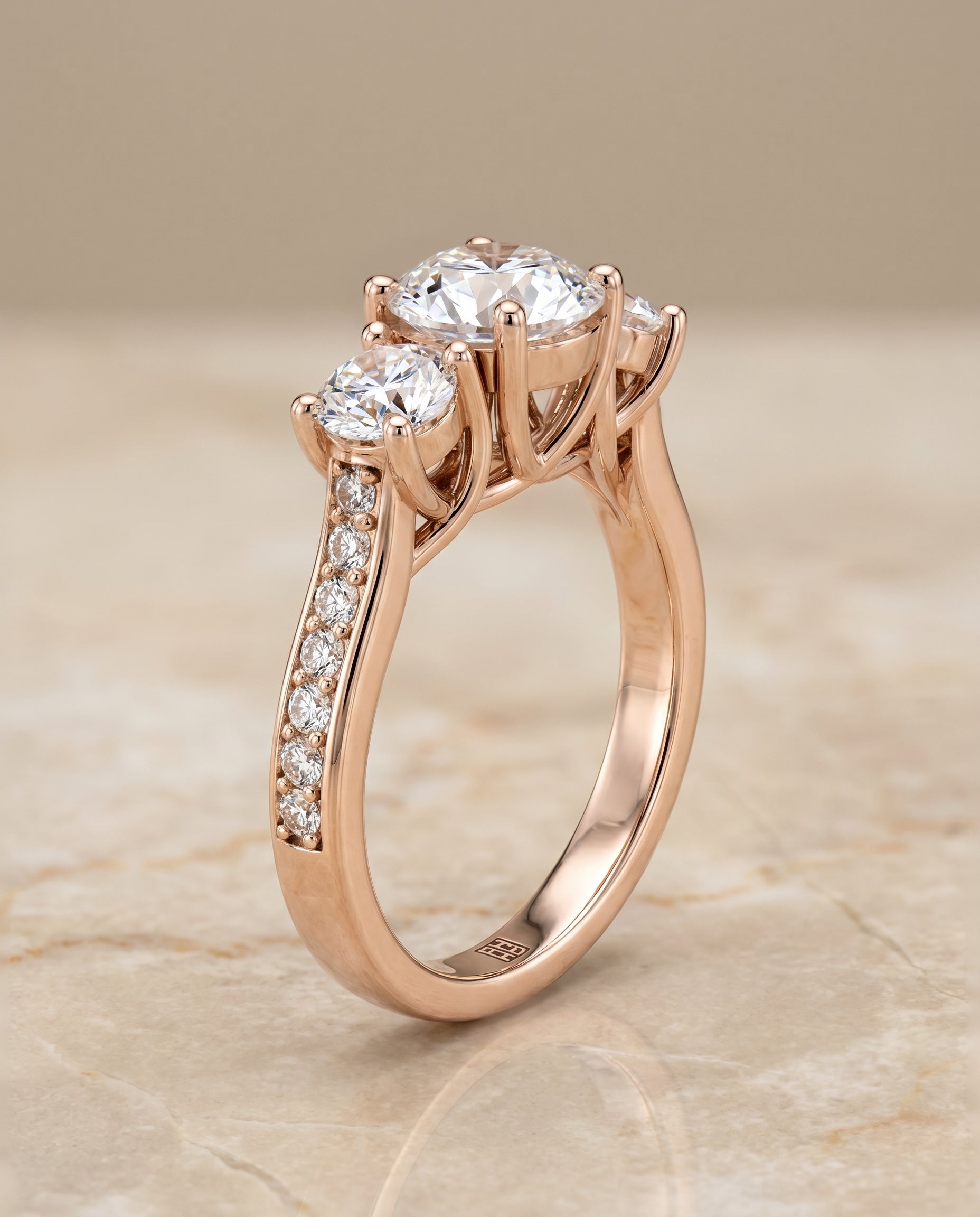 Avery Select Channel Pavé Three Stone Round Lab Diamond Engagement Ring in 14K Rose Gold, front view | RockHer