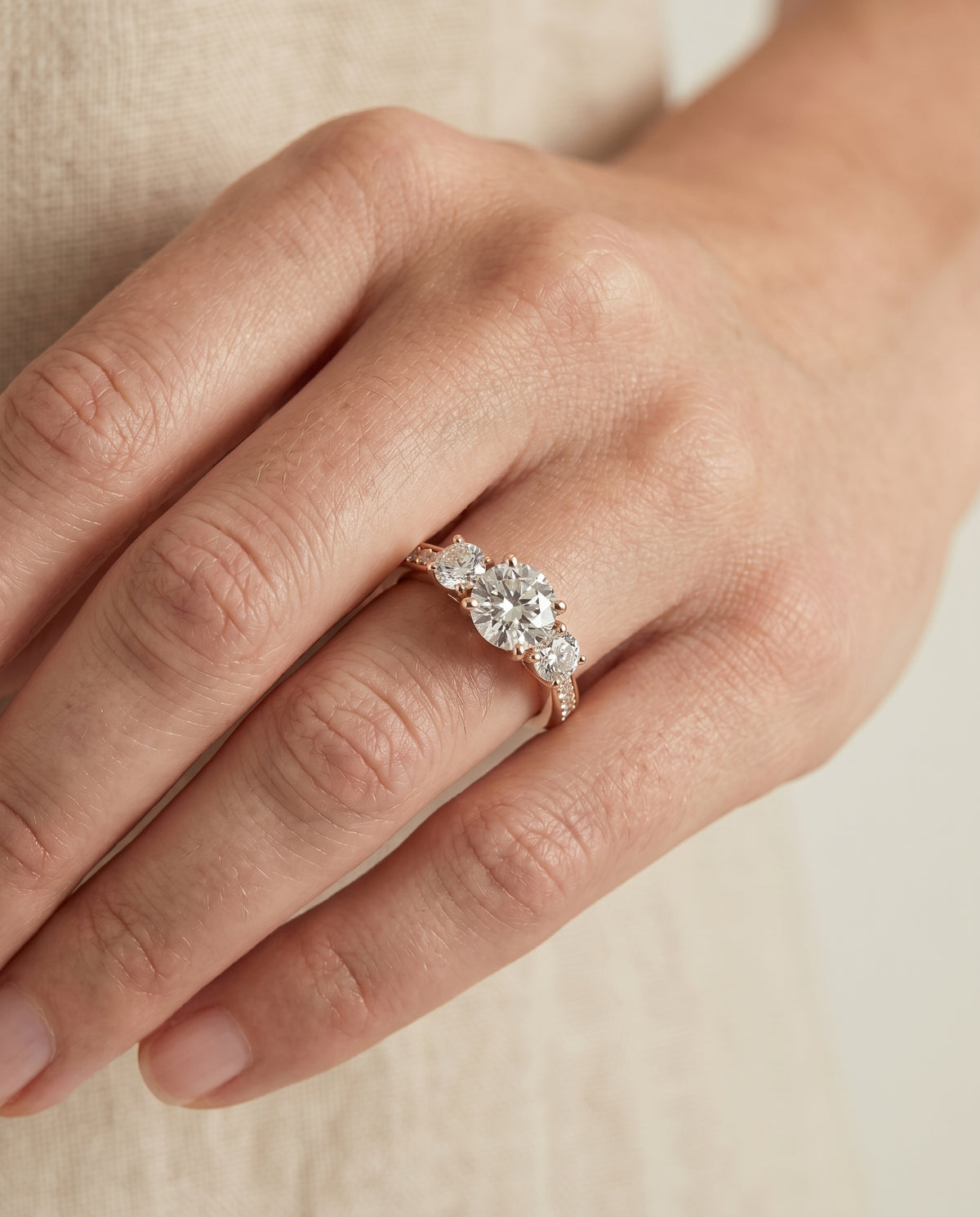 The Avery engagement ring setting in 14K Rose Gold, channel pavé three stone design | RockHer