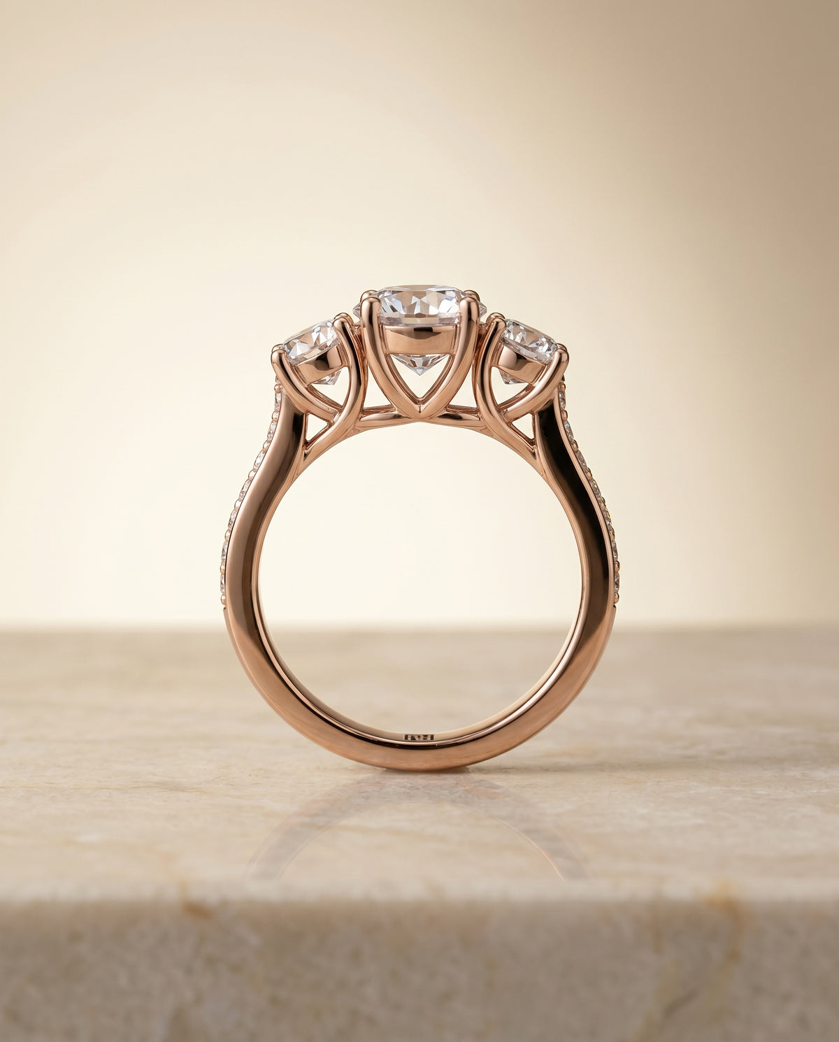 The Avery channel pavé three stone engagement ring setting, shown in 14K Rose Gold | RockHer