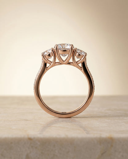 Round Brilliant, Channel Pavé Three Stone, in 14K Rose Gold, pave setting – side profile | RockHer