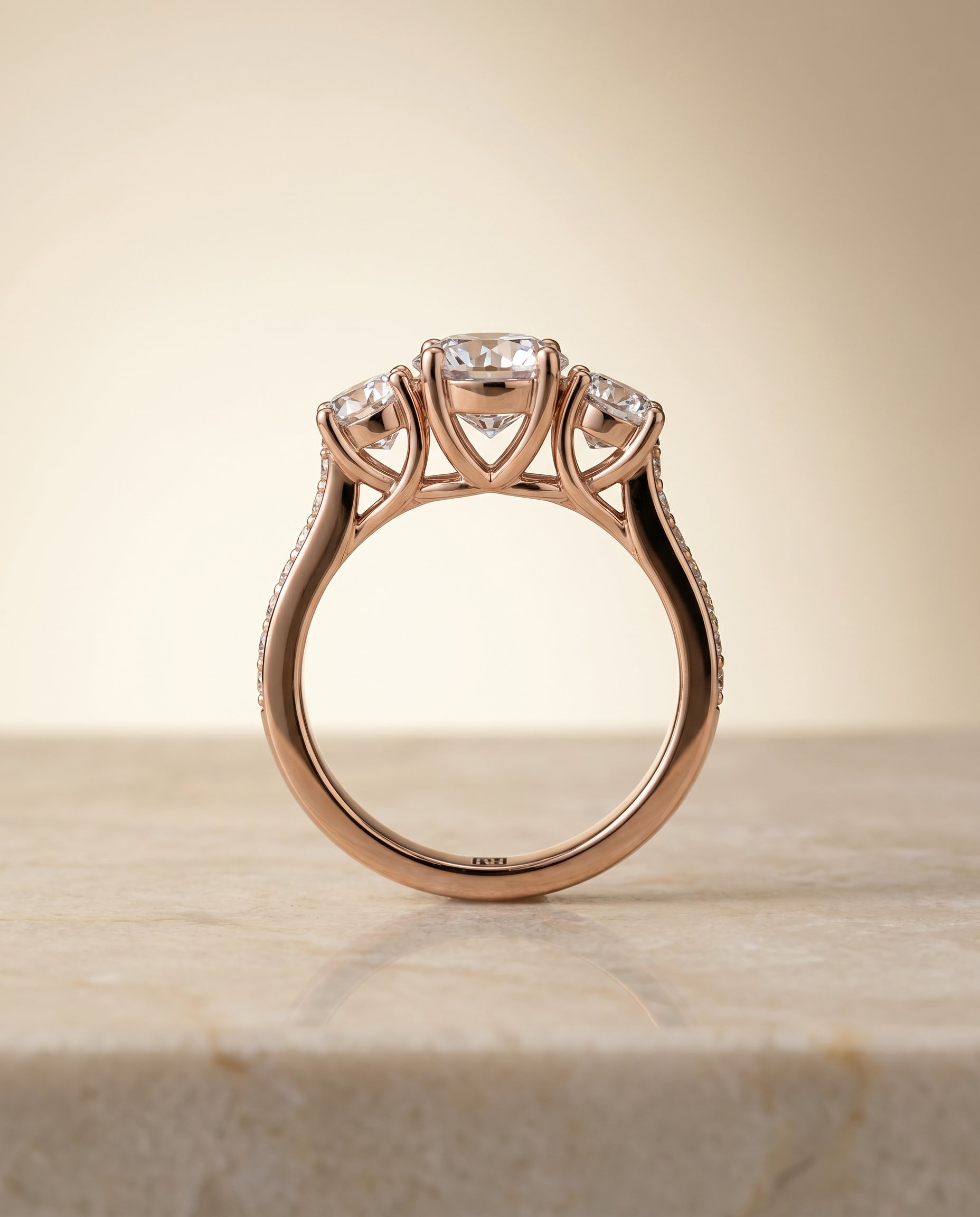 Avery Select Channel Pavé Three Stone Round Lab Diamond Engagement Ring in 14K Rose Gold, side view | RockHer
