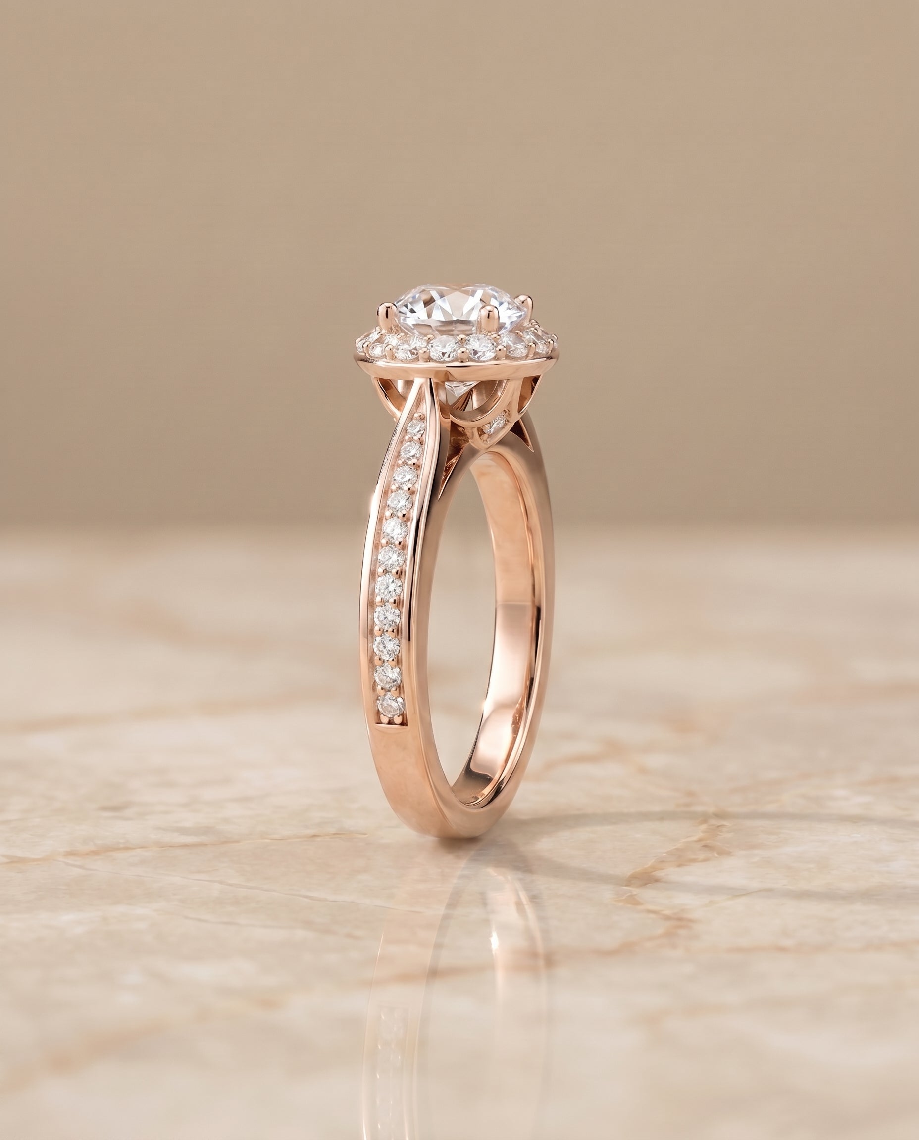 The Aria channel row pavé halo engagement ring setting, shown in 14K Rose Gold | RockHer