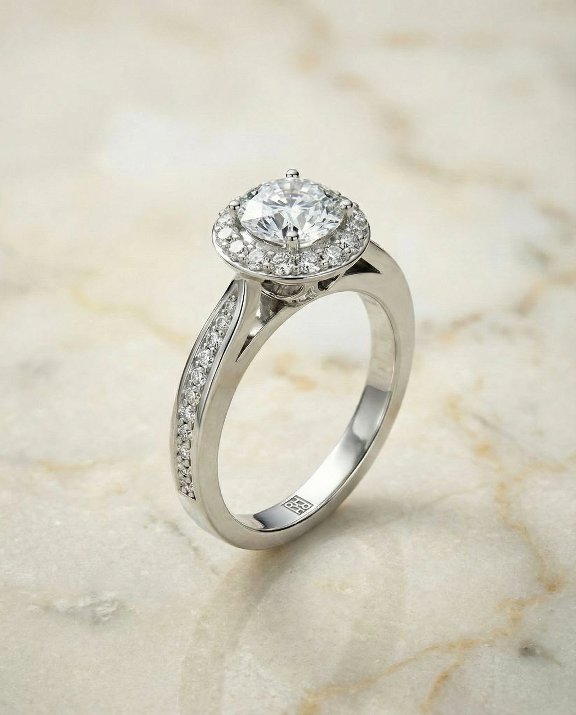 The Aria channel row pavé halo engagement ring setting, shown in 18K White Gold | RockHer