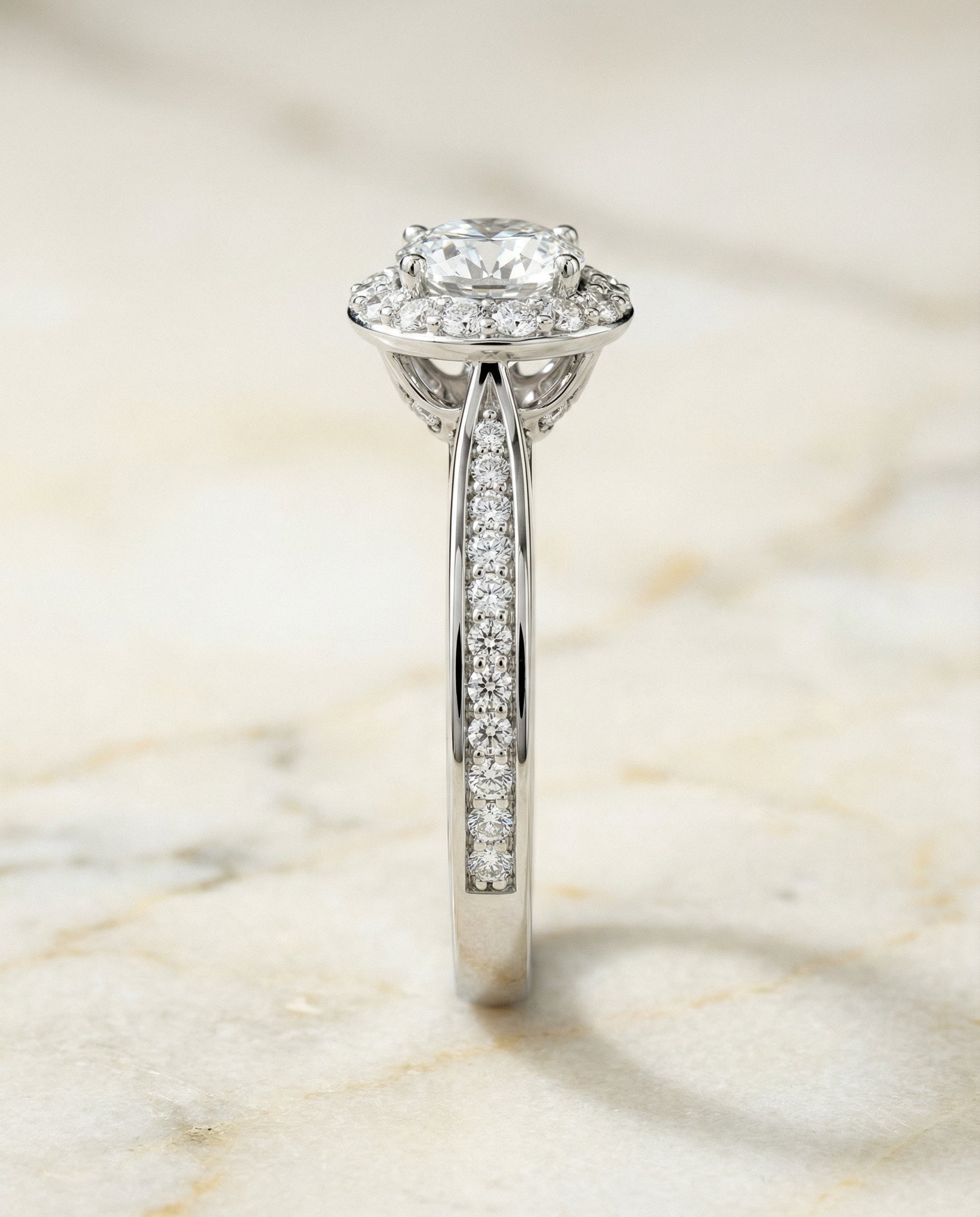 Channel Row Pavé Halo styling on The Aria round engagement ring setting | RockHer