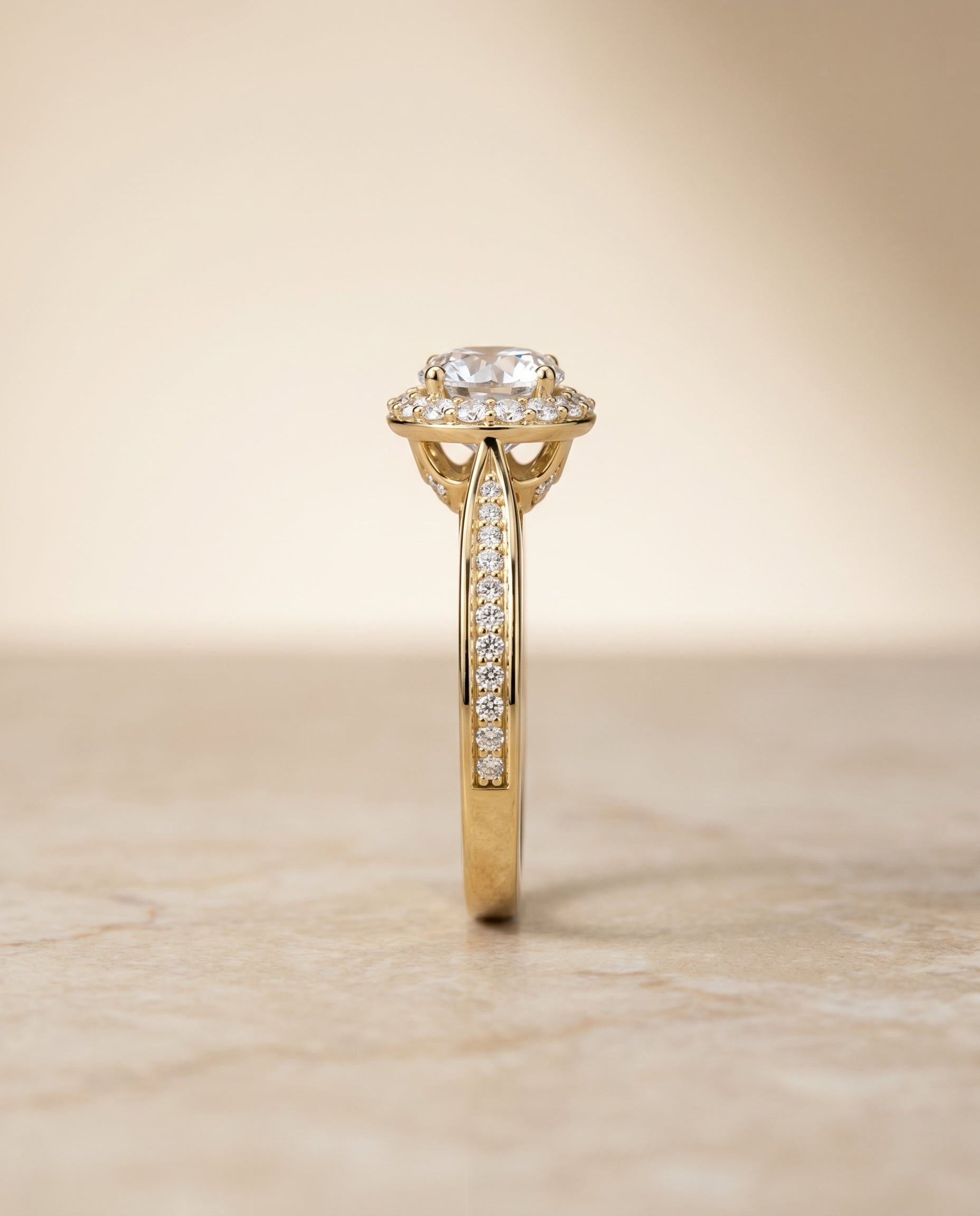The Aria channel row pavé halo engagement ring setting, shown in 18K Yellow Gold | RockHer