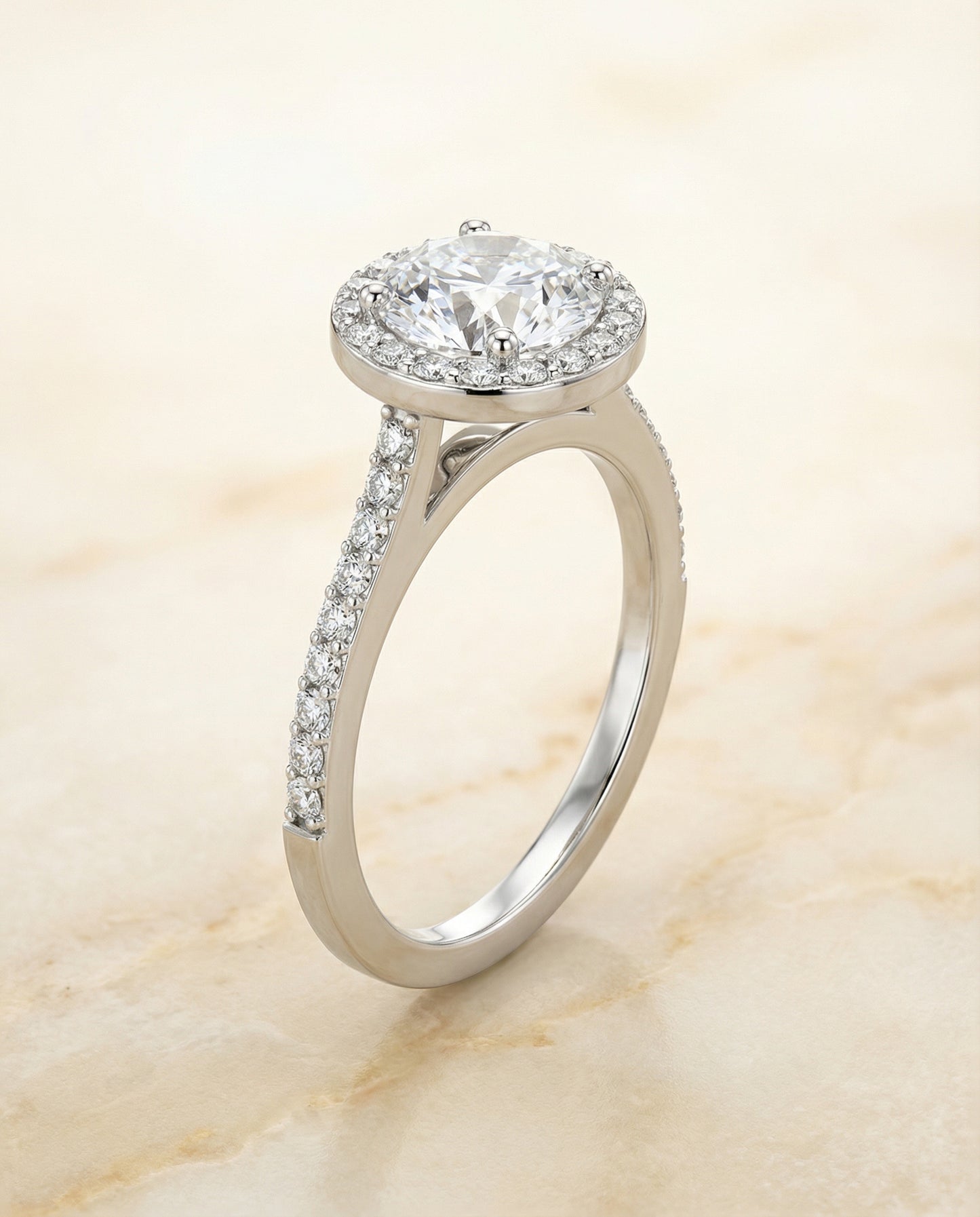 Round Brilliant, Classic French Pavé Halo, in 18K White Gold, pave setting – angled view | RockHer