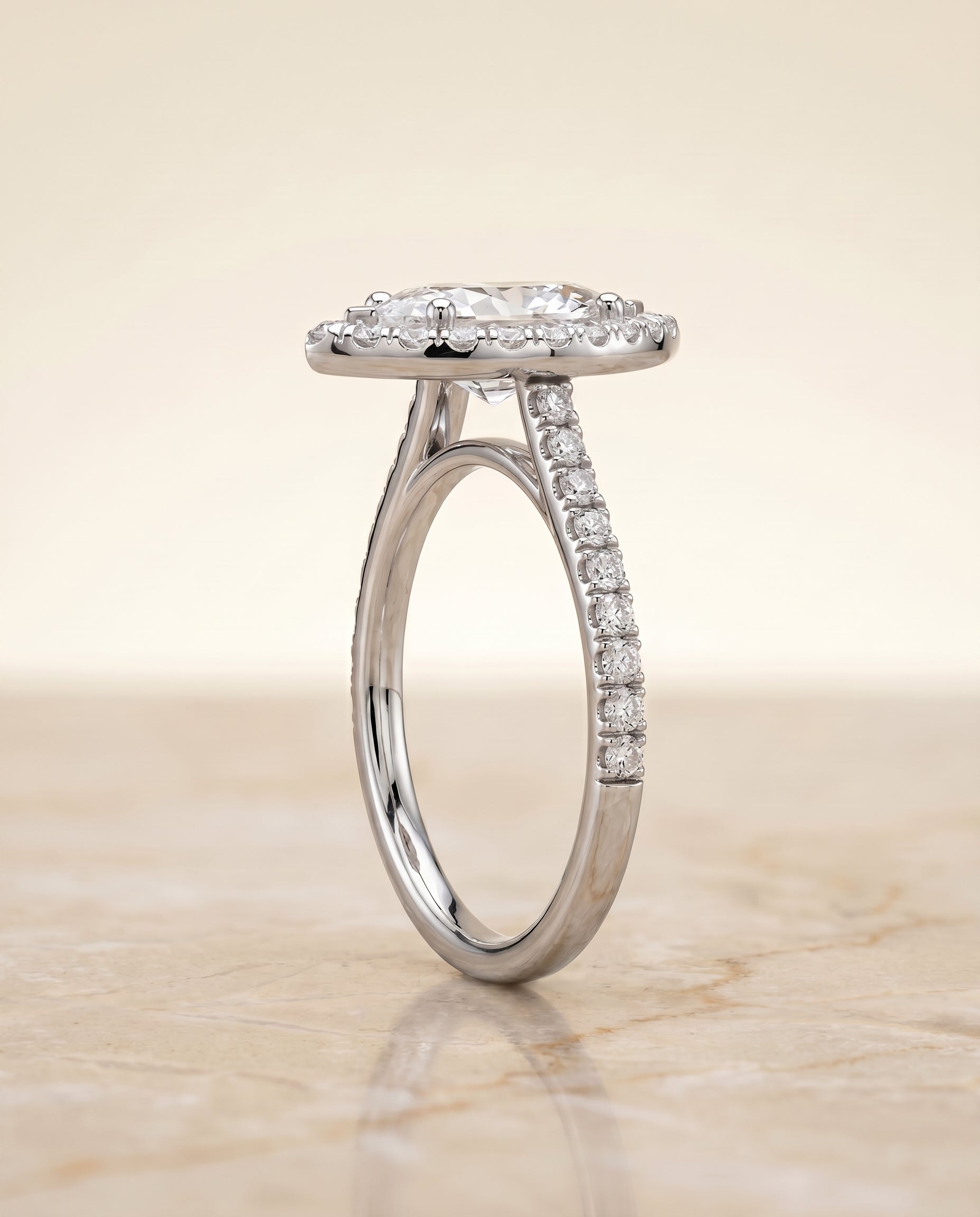 The Sade classic french pavé halo linear engagement ring setting, shown in Platinum | RockHer