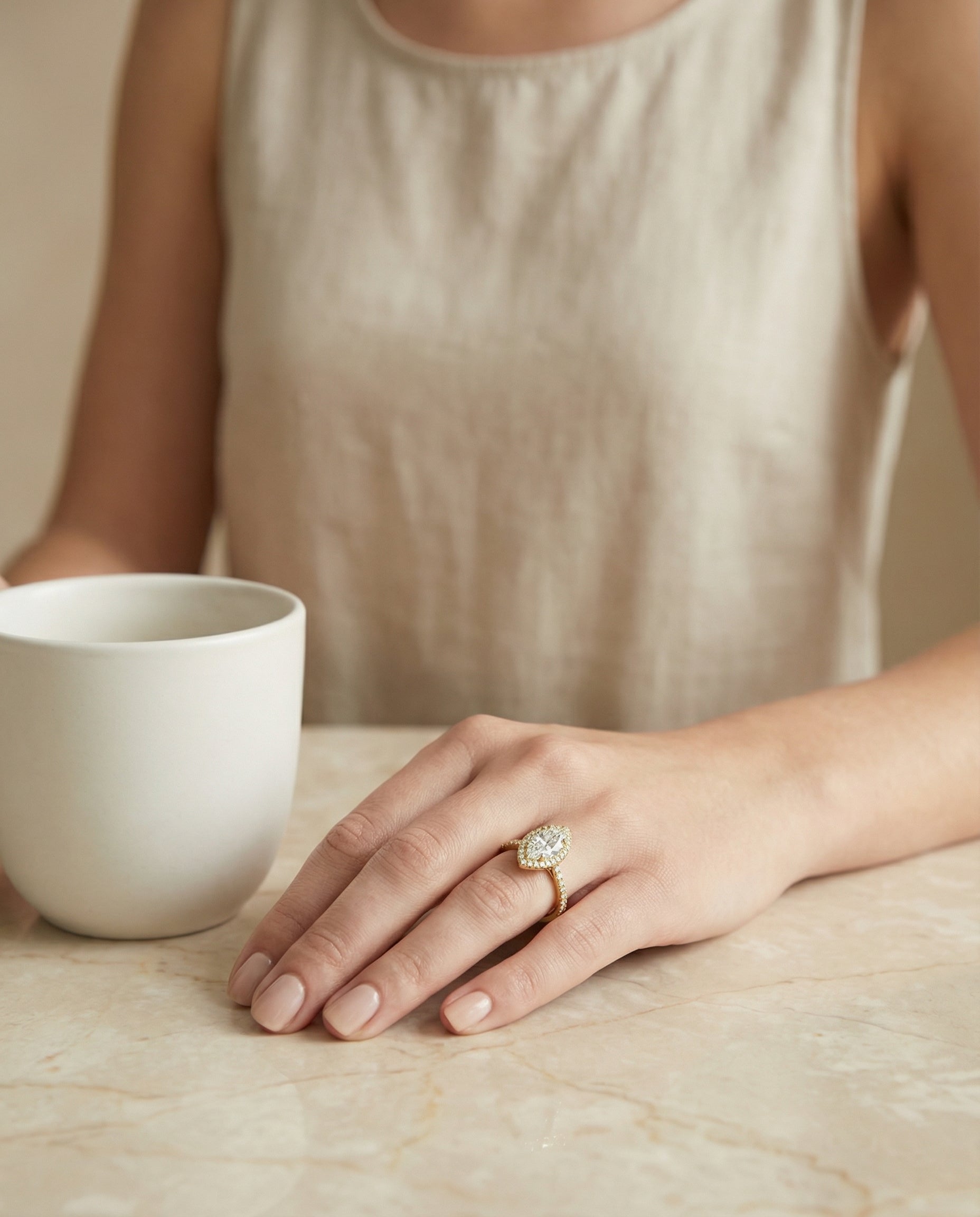 The Sade marquise setting in 18K Yellow Gold, a classic french pavé halo linear design from RockHer