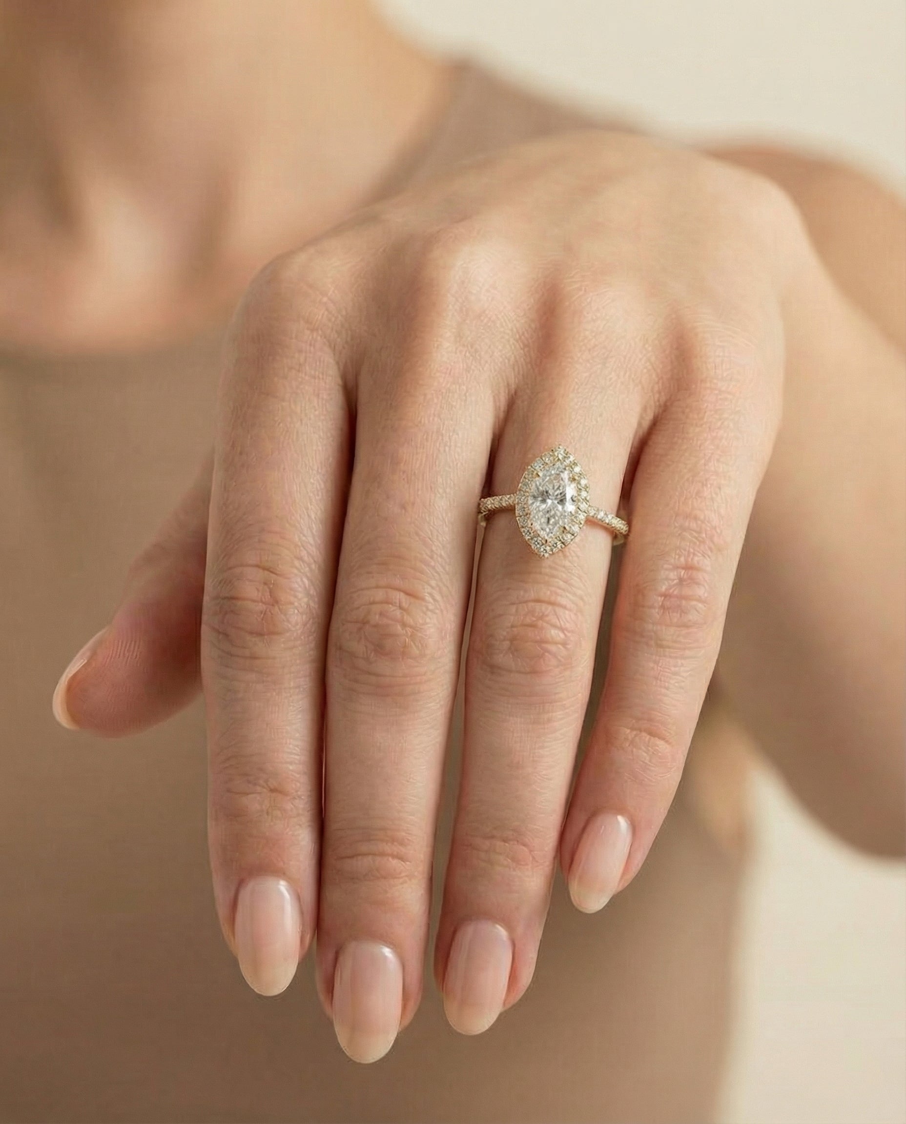 The Sade classic french pavé halo linear engagement ring setting, shown in 18K Yellow Gold | RockHer