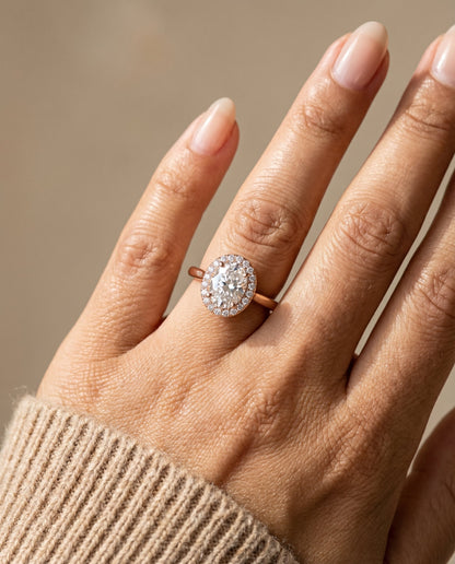 Kate Select classic french pavé halo oval oval ring in 14K Rose Gold — on hand angled — RockHer