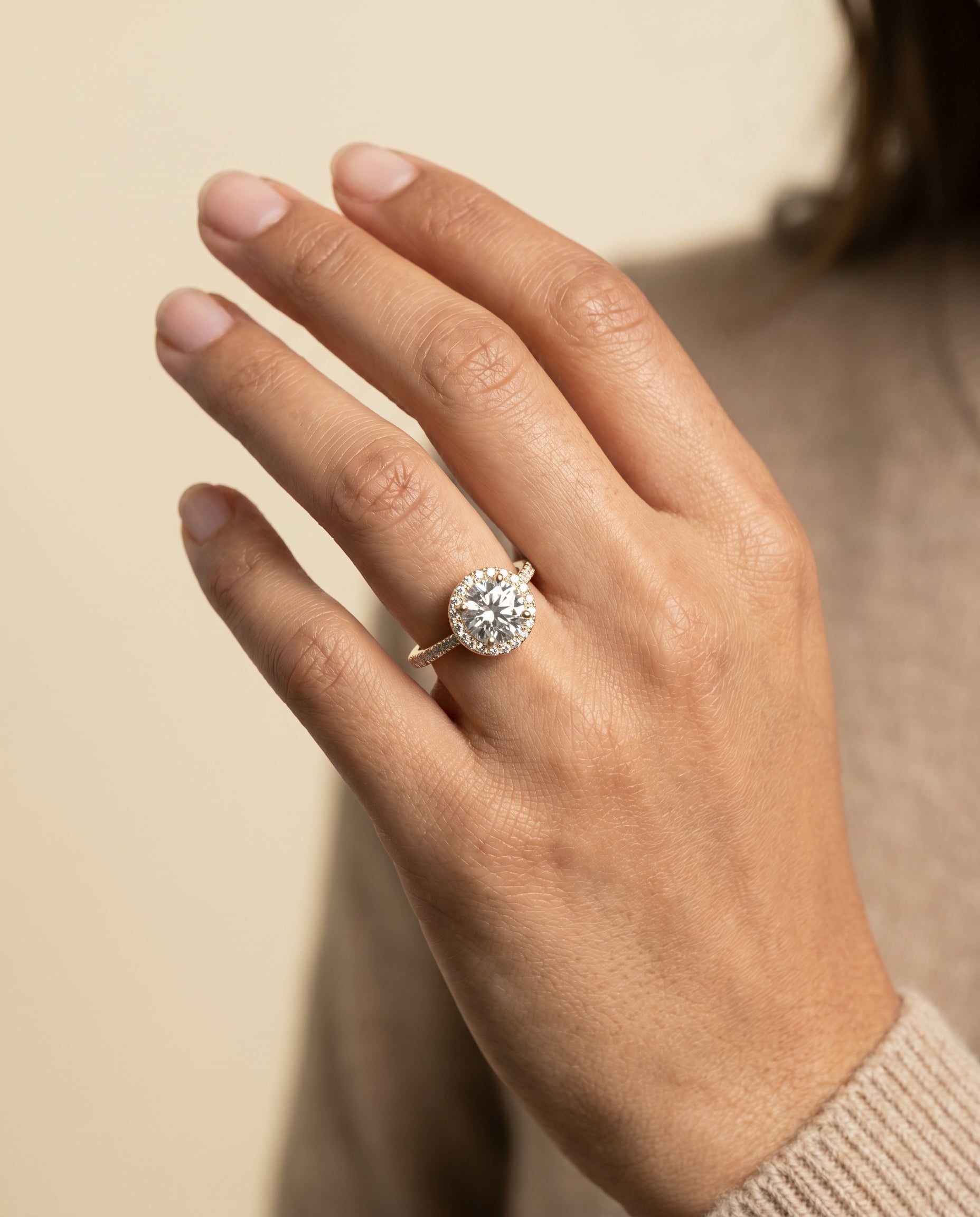 Taylor Select Pavé Halo Round Lab Diamond Engagement Ring in 18K Yellow Gold, shown on hand | RockHer