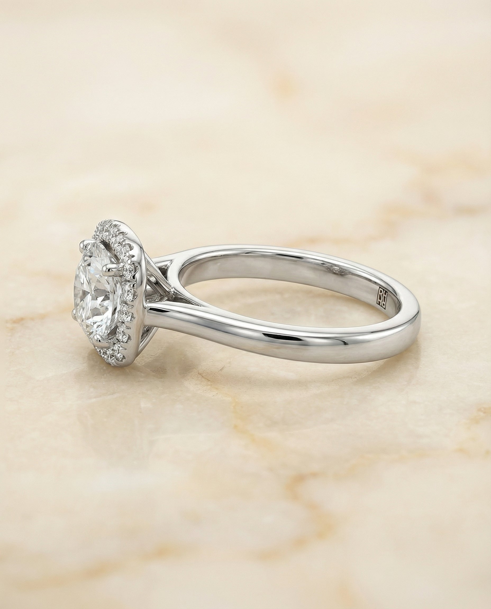 The Carnie classic prong diamond halo engagement ring setting, shown in Platinum | RockHer