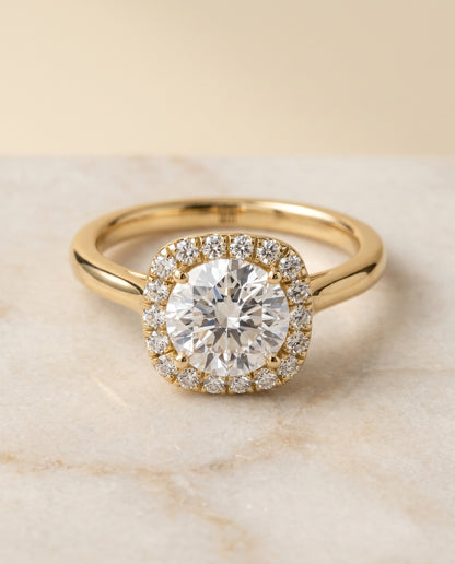 Round Brilliant, Classic Prong Diamond Halo, in 18K Yellow Gold, pave setting – angled view | RockHer