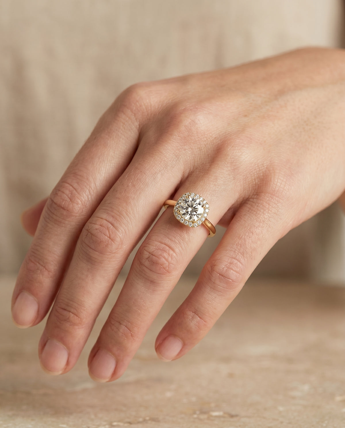 The Carnie engagement ring setting in 18K Yellow Gold, classic prong diamond halo design | RockHer