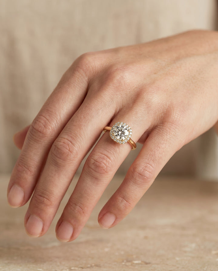 Round Brilliant, Classic Prong Diamond Halo, in 18K Yellow Gold, pave setting – lifestyle shot | RockHer
