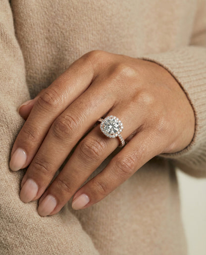 Bianca Select classic prong halo round ring in 14K Rose Gold — on hand angled — RockHer