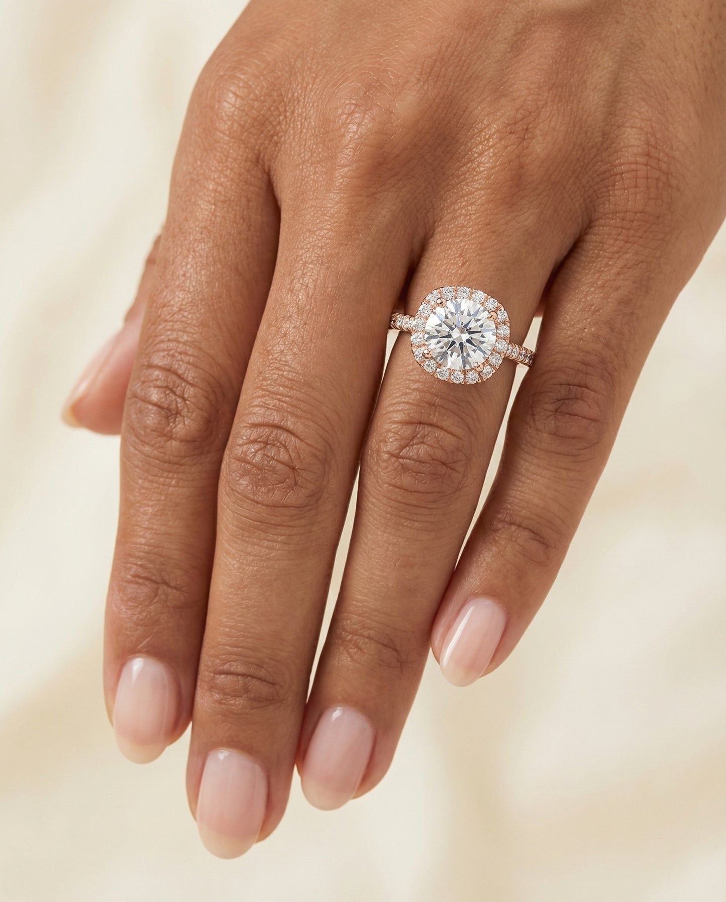 Round Brilliant, Classic Prong Halo, in 14K Rose Gold, pave setting – lifestyle shot | RockHer