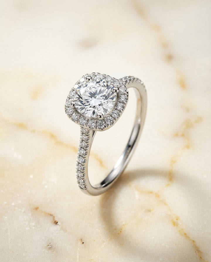 Round Brilliant, Classic Prong Halo, in Platinum, pave setting – angled view | RockHer