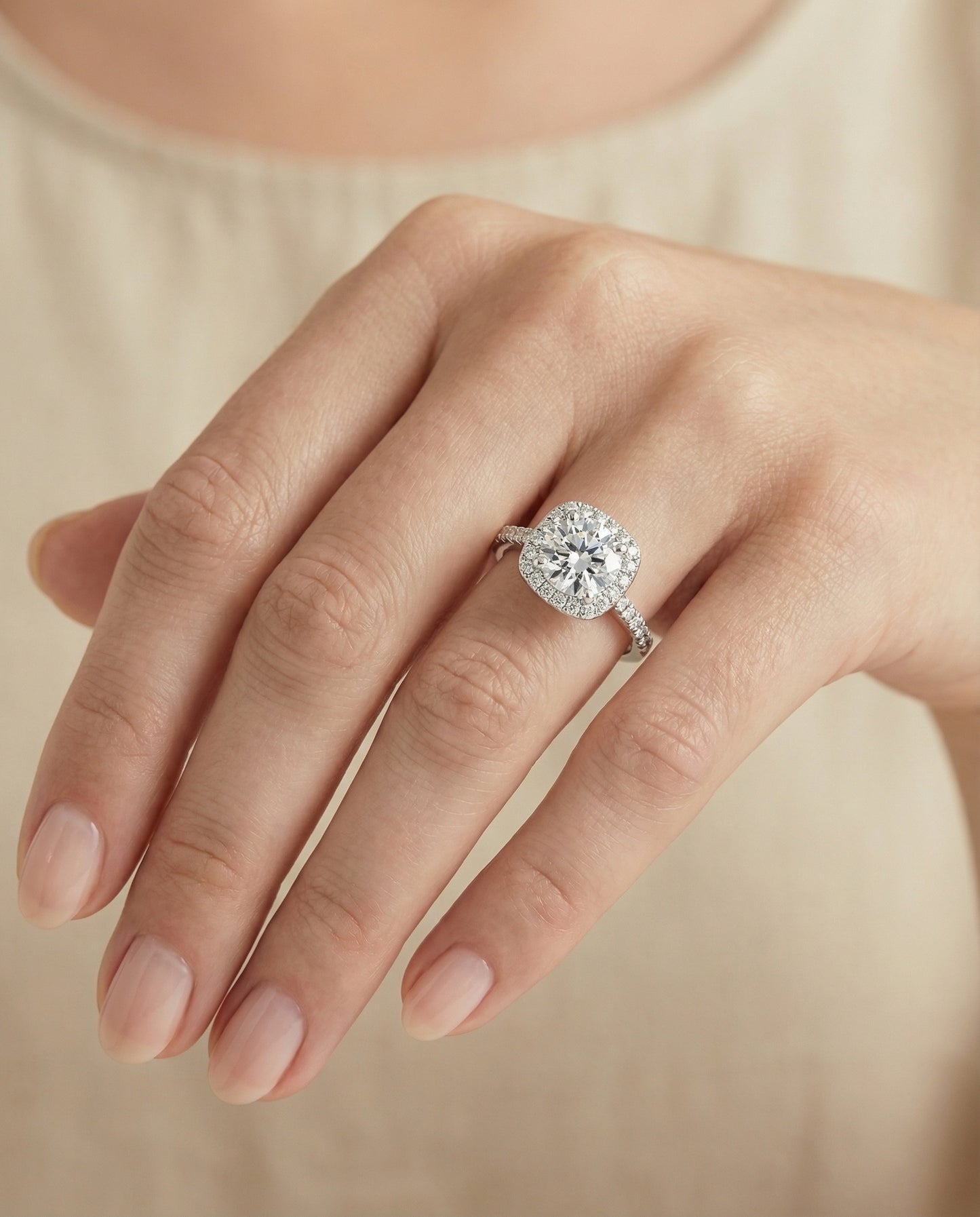 Round Brilliant, Classic Prong Halo, in Platinum, pave setting – lifestyle shot | RockHer