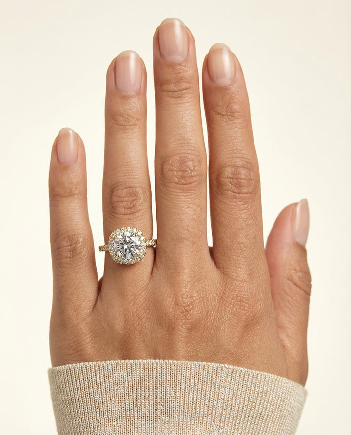 Round Brilliant, Classic Prong Halo, in 18K Yellow Gold, pave setting – lifestyle shot | RockHer