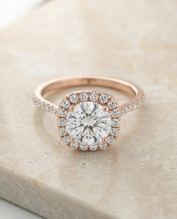 Everly Select classic shared prong halo round ring in 14K Rose Gold — alt angle — RockHer
