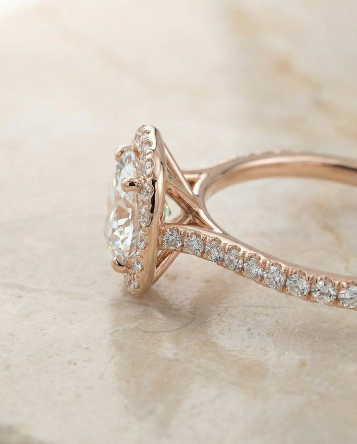 Everly Select classic shared prong halo round ring in 14K Rose Gold — side — RockHer