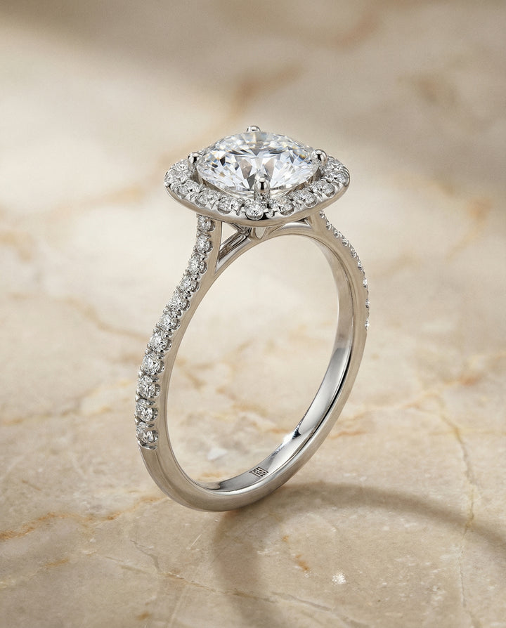 Round Brilliant, Classic Shared Prong Halo Round, in Platinum, pave setting – front view | RockHer