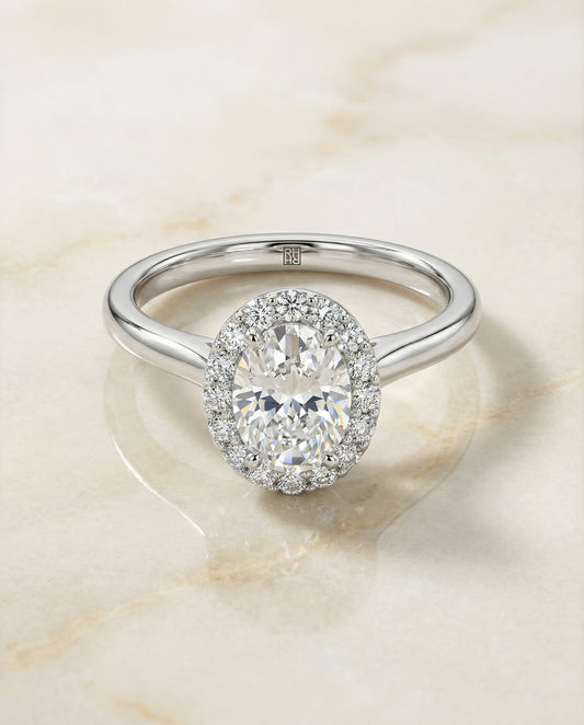 Classic Shared Prong Halo Oval, in Platinum, pave setting – angled view | RockHer
