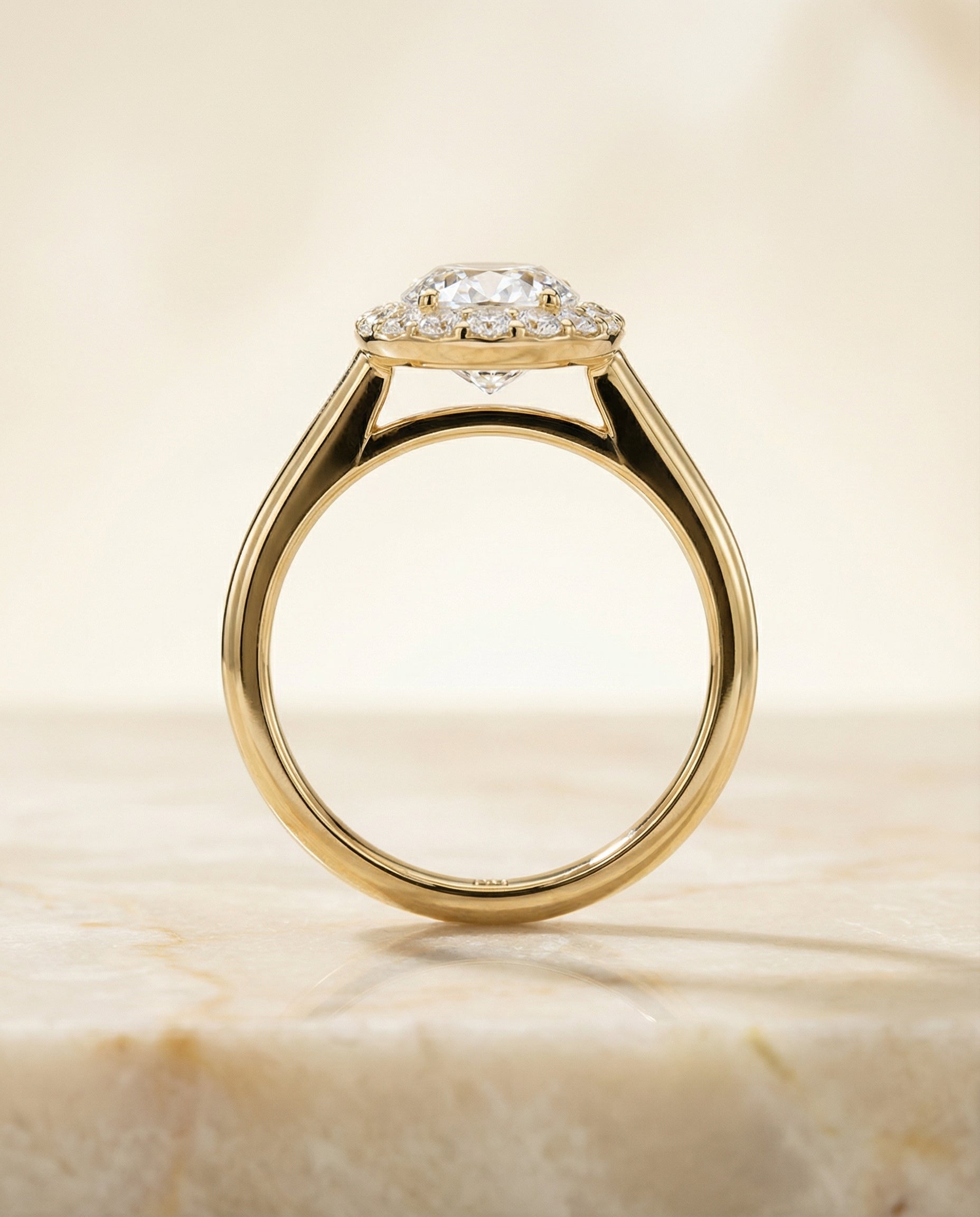 The Etta classic shared prong halo engagement ring setting, shown in 18K Yellow Gold | RockHer