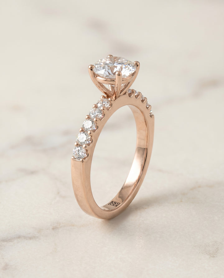 Round Brilliant, Classic Shared Prong Linear Pavé, in 14K Rose Gold – front view | RockHer
