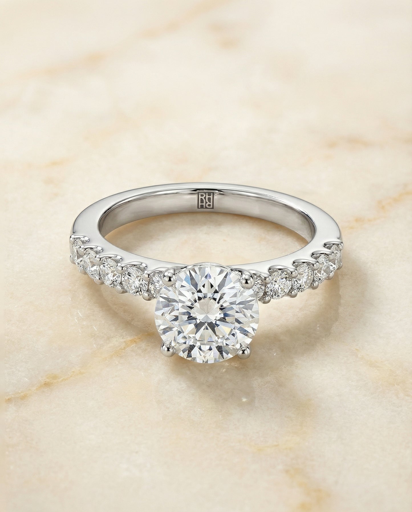 Round Brilliant, Classic Shared Prong Linear Pavé, in Platinum – angled view | RockHer