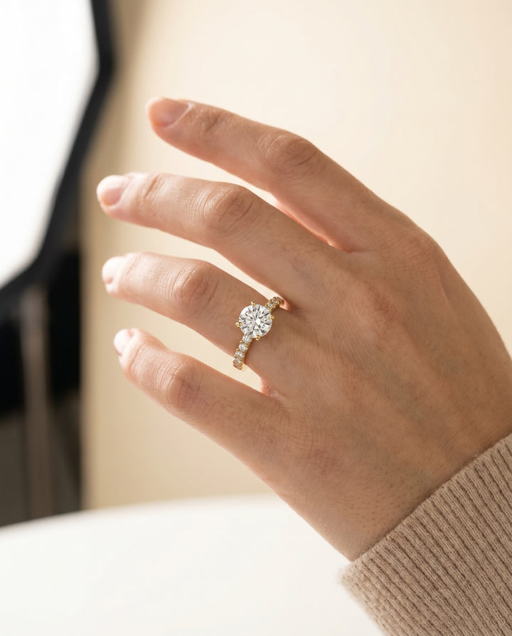 Round Brilliant, Classic Shared Prong Linear Pavé, in 18K Yellow Gold – lifestyle shot | RockHer