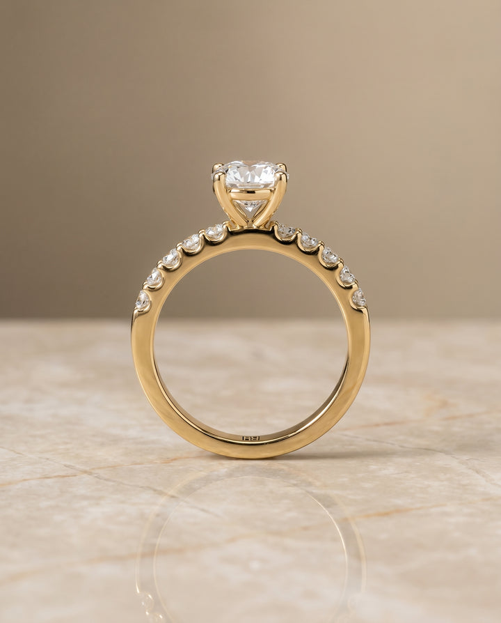 Round Brilliant, Classic Shared Prong Linear Pavé, in 18K Yellow Gold – side profile | RockHer