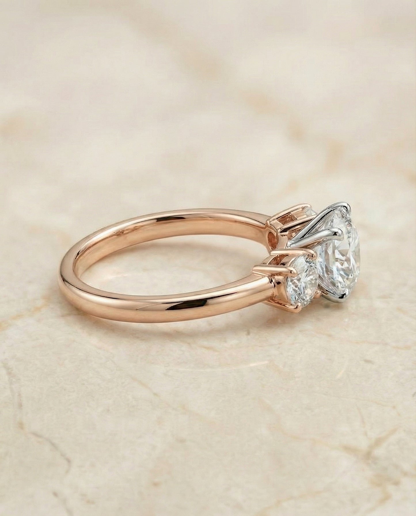 Anita Select classic three stone round ring in 14K Rose Gold — side — RockHer