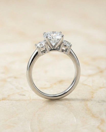 Round Brilliant, Classic Three Stone Round, in Platinum, prong setting – side profile | RockHer